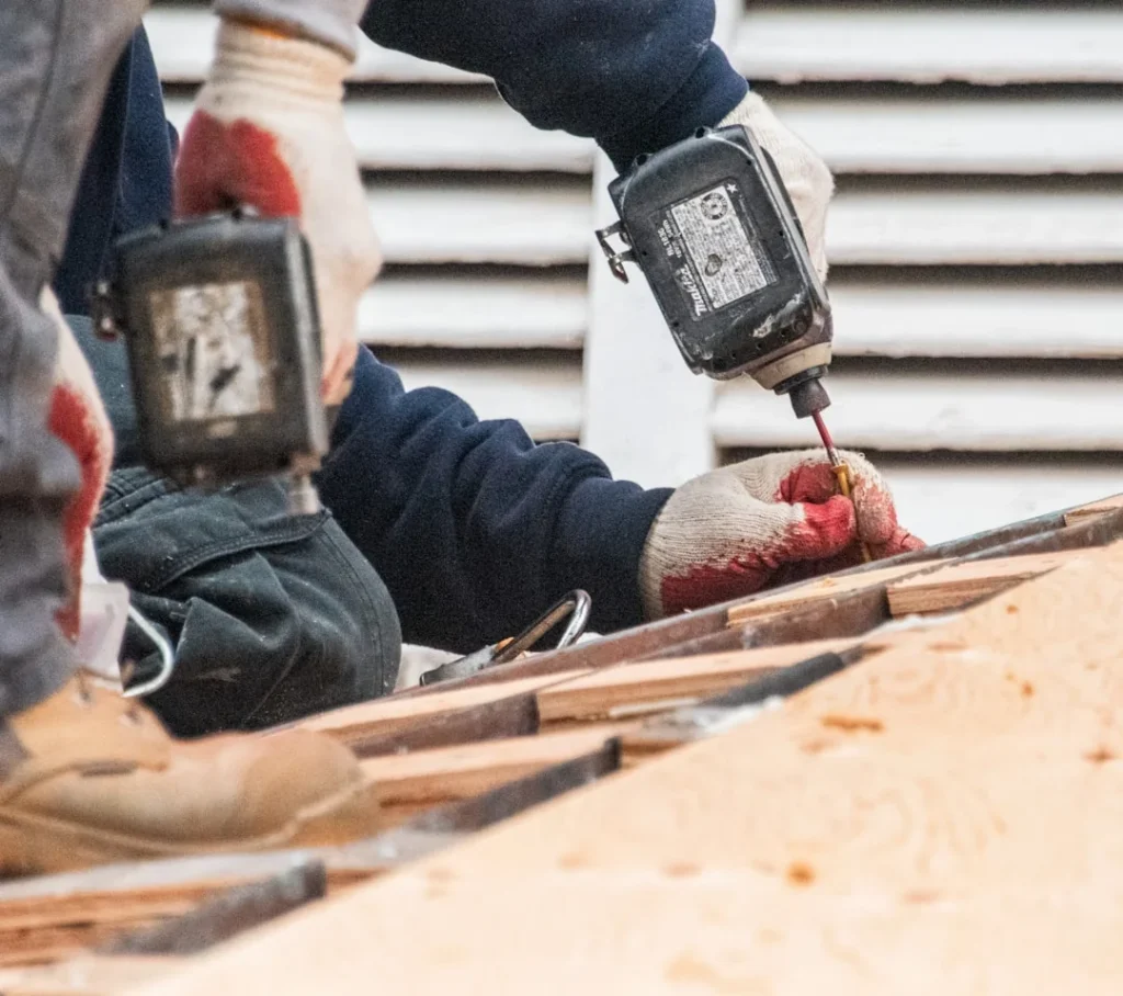 Worker with power drill